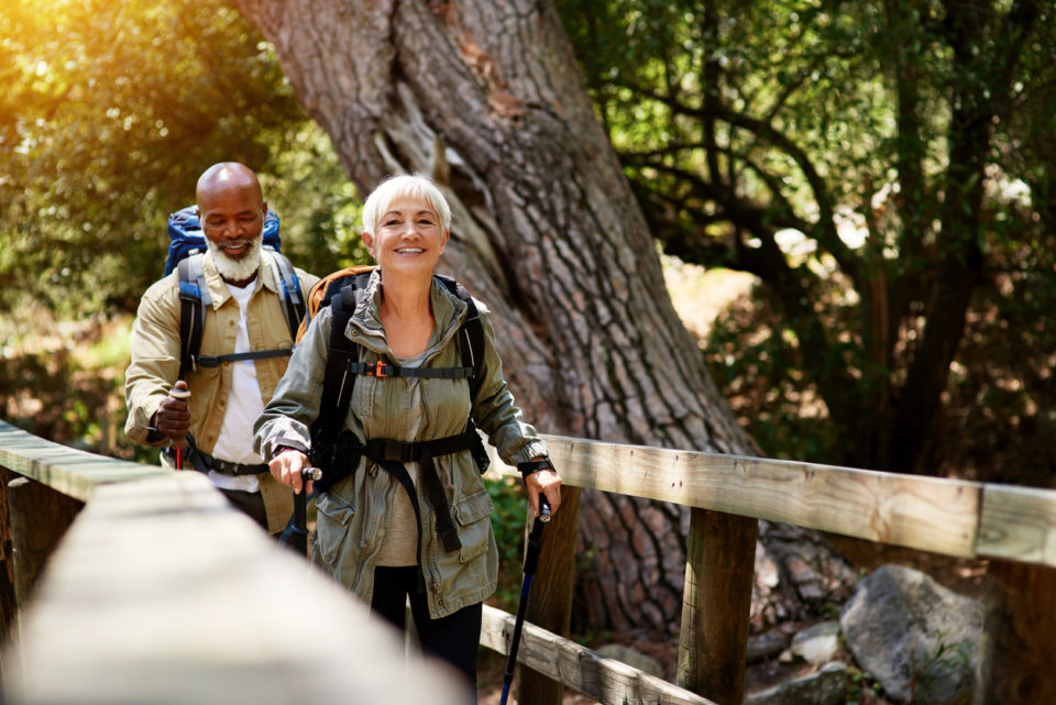 Couple enjoying themselves while out for a hike.