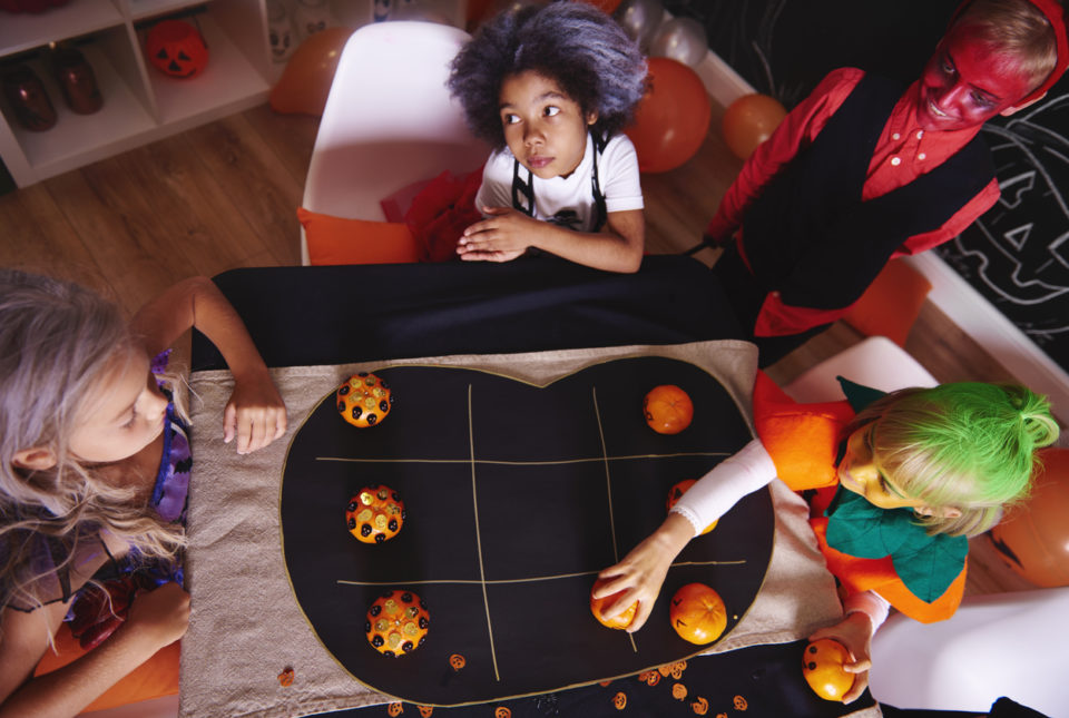 Kids spending time together while playing Halloween game