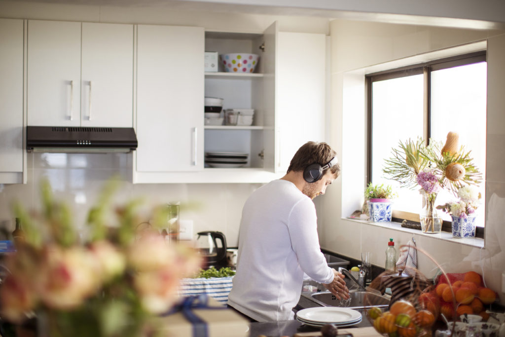 Adult man preparing food in the kitchen.