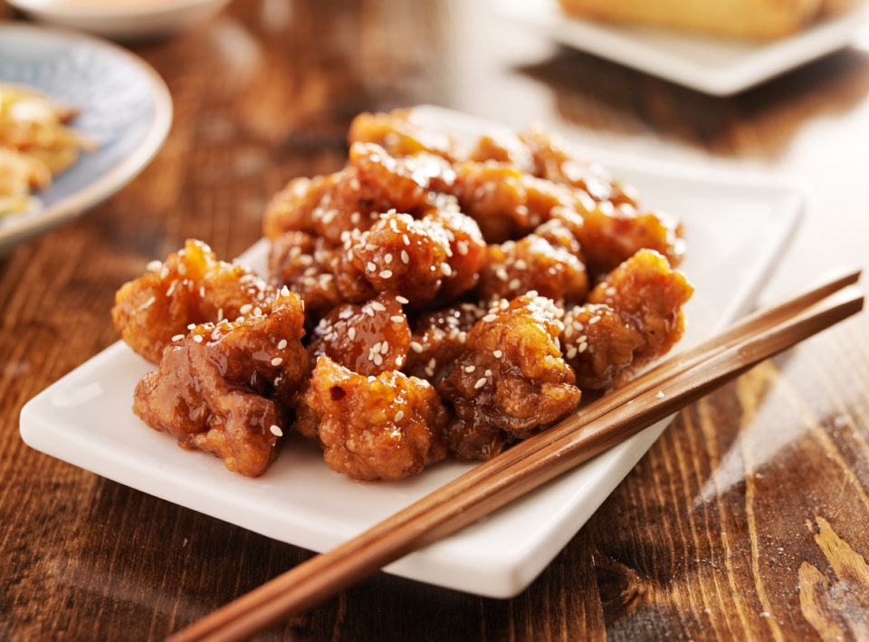 chinese sesame chicken with chopsticks