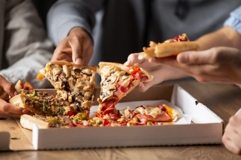 Young people sharing a pizza