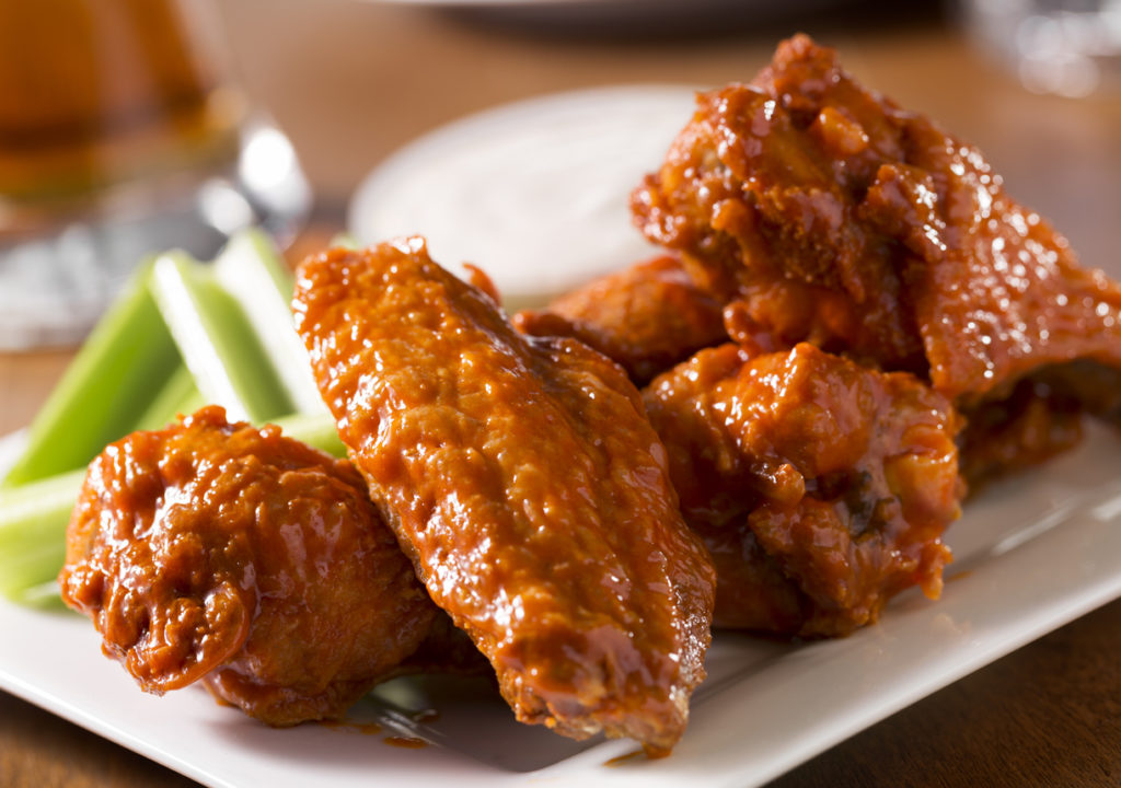 A plate of buffalo style chicken wings