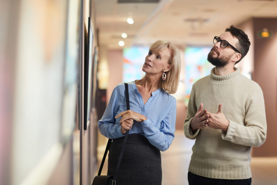 Couple Enjoying Art Exhibition in Museum