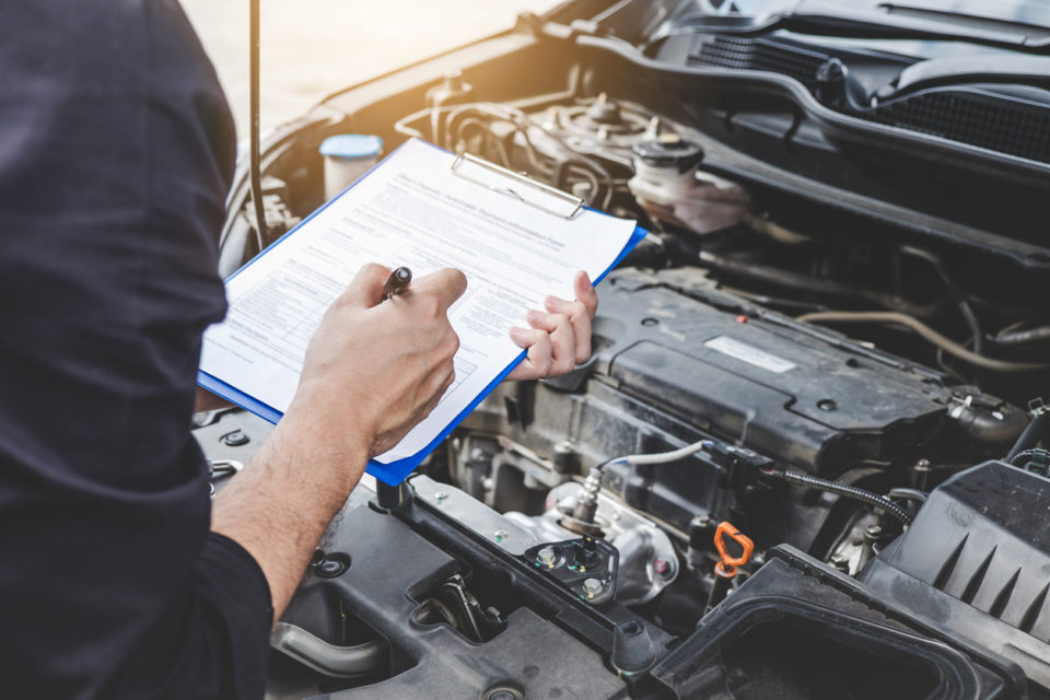 mechanic servicing car