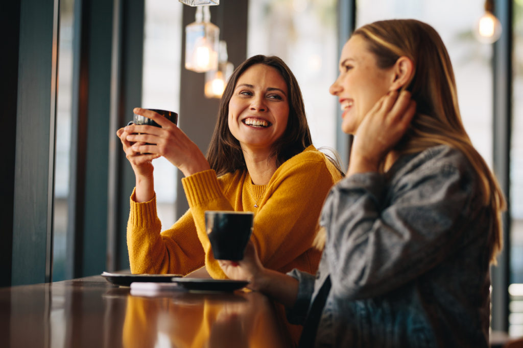 Friends meeting in coffee shop on a weekend