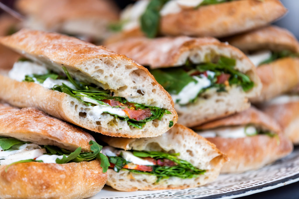 Closeup of fresh display of stacked pile of panini bread